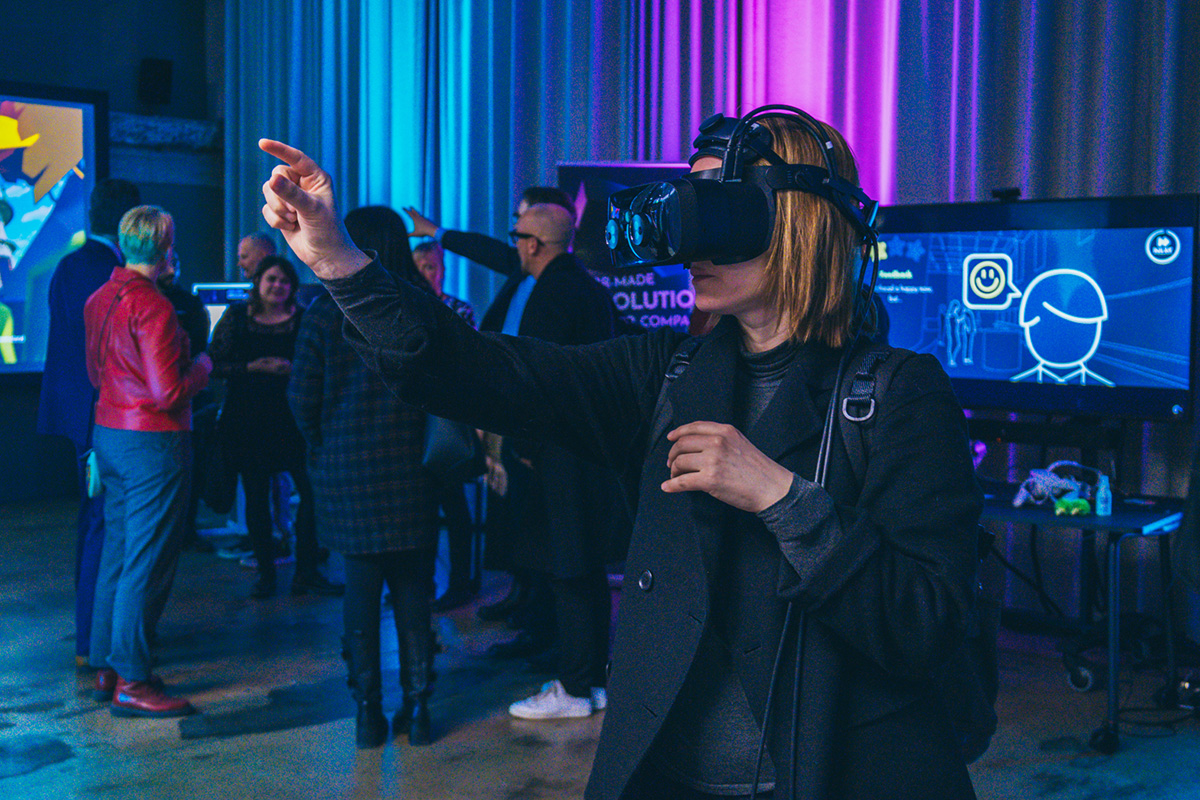 A person trying out a Mixed Reality headset at Match XR 2022 event.